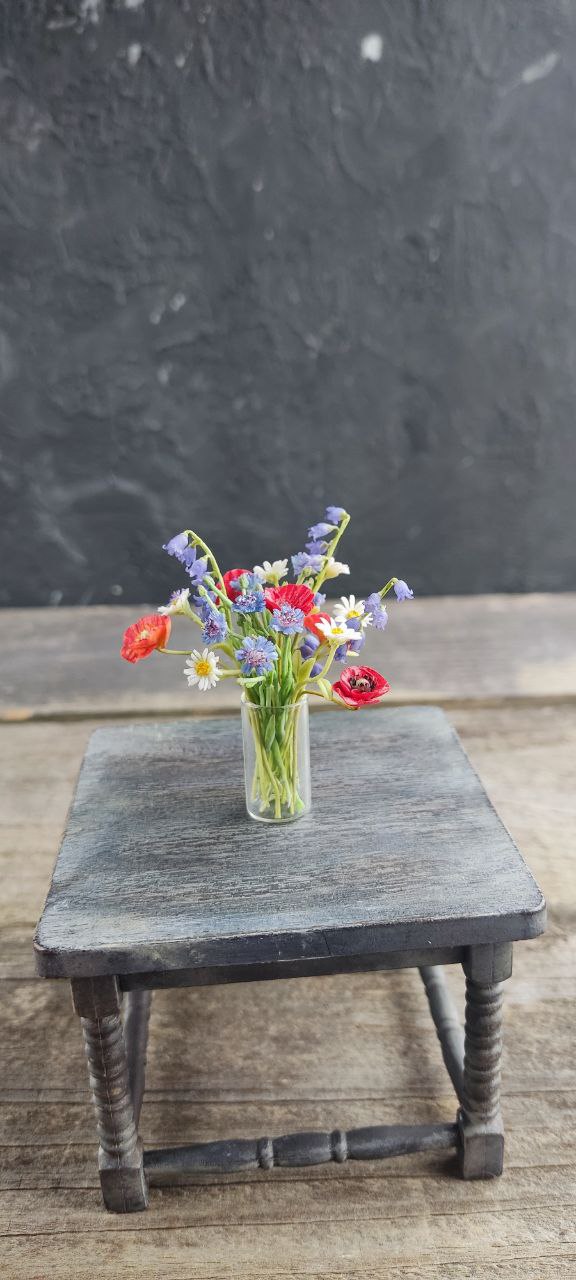 Field bouquet of daisies, poppies, bells and cornflowers.