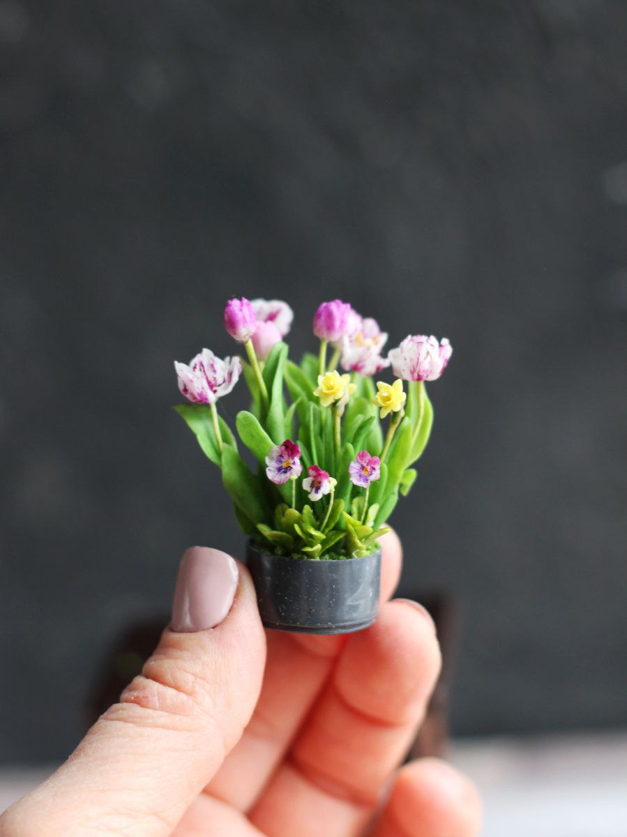 Easter arrangement with tulips, violet, daffodils and rabbit
