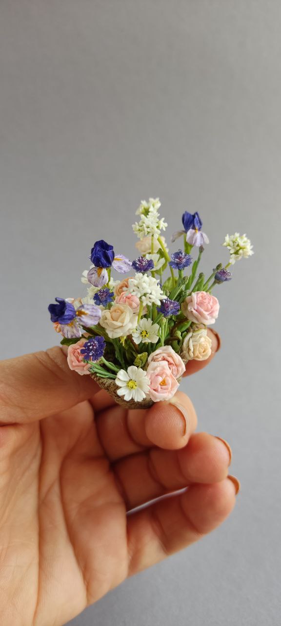 Basket of irises and roses