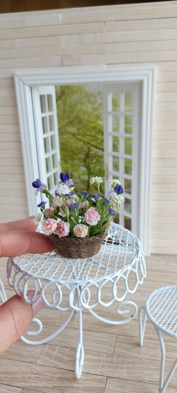 Basket of irises and roses