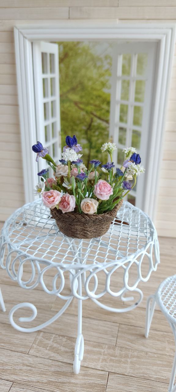 Basket of irises and roses