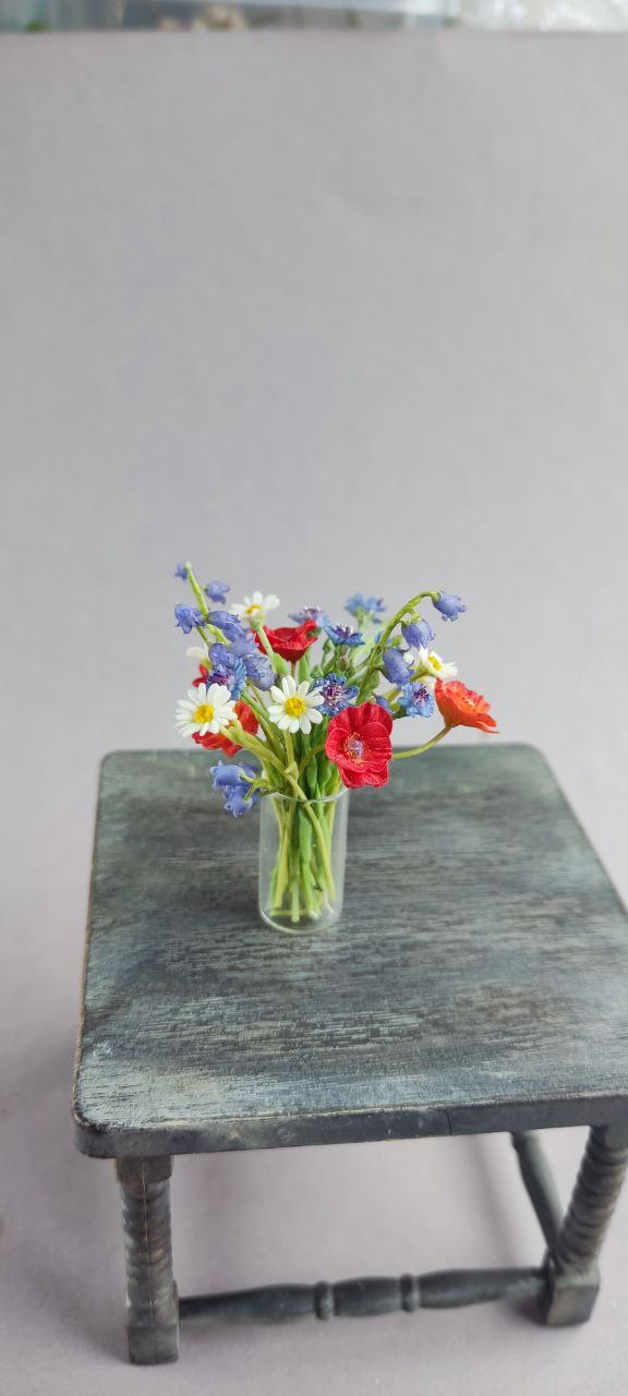 Field bouquet of daisies, poppies, bells and cornflowers.