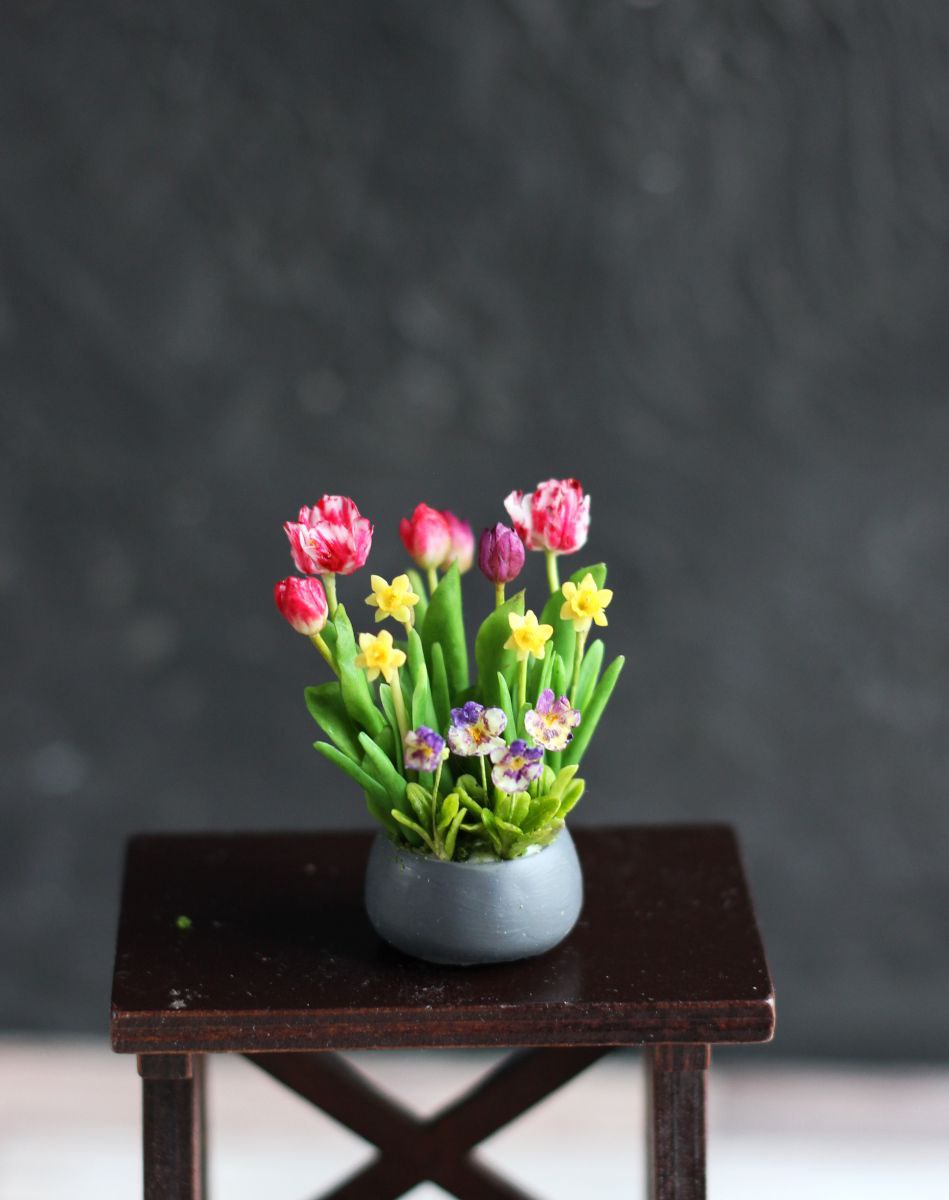 Easter arrangement with tulips, violet, daffodils and rabbit