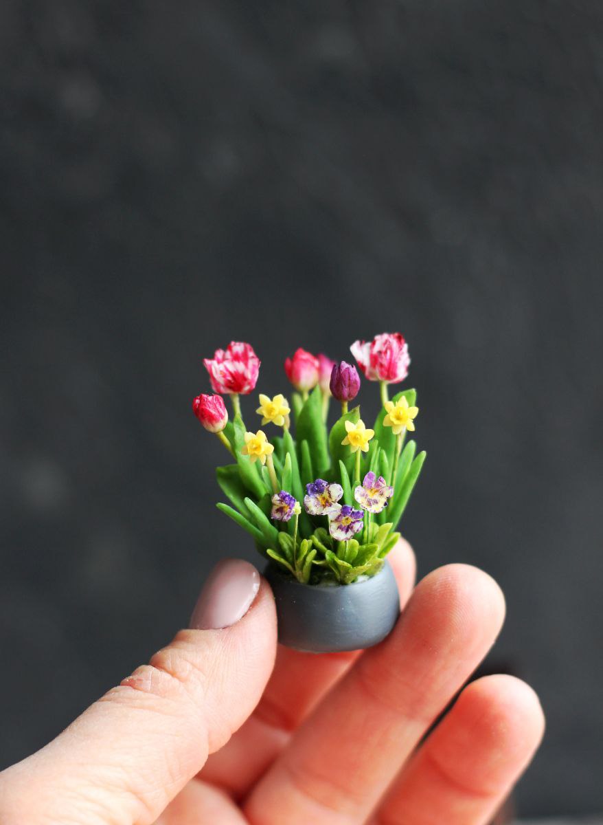 Easter arrangement with tulips, violet, daffodils and rabbit