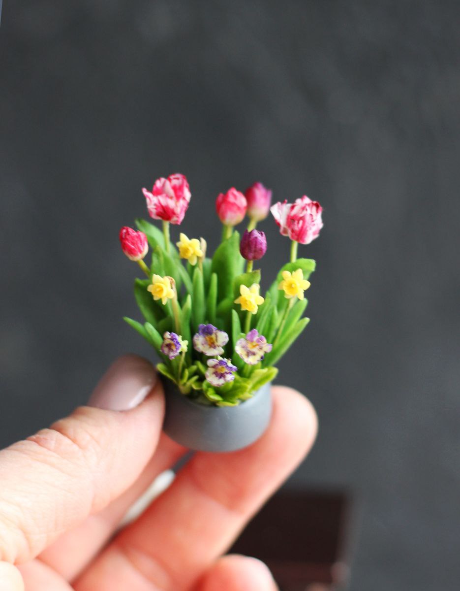 Easter arrangement with tulips, violet, daffodils and rabbit