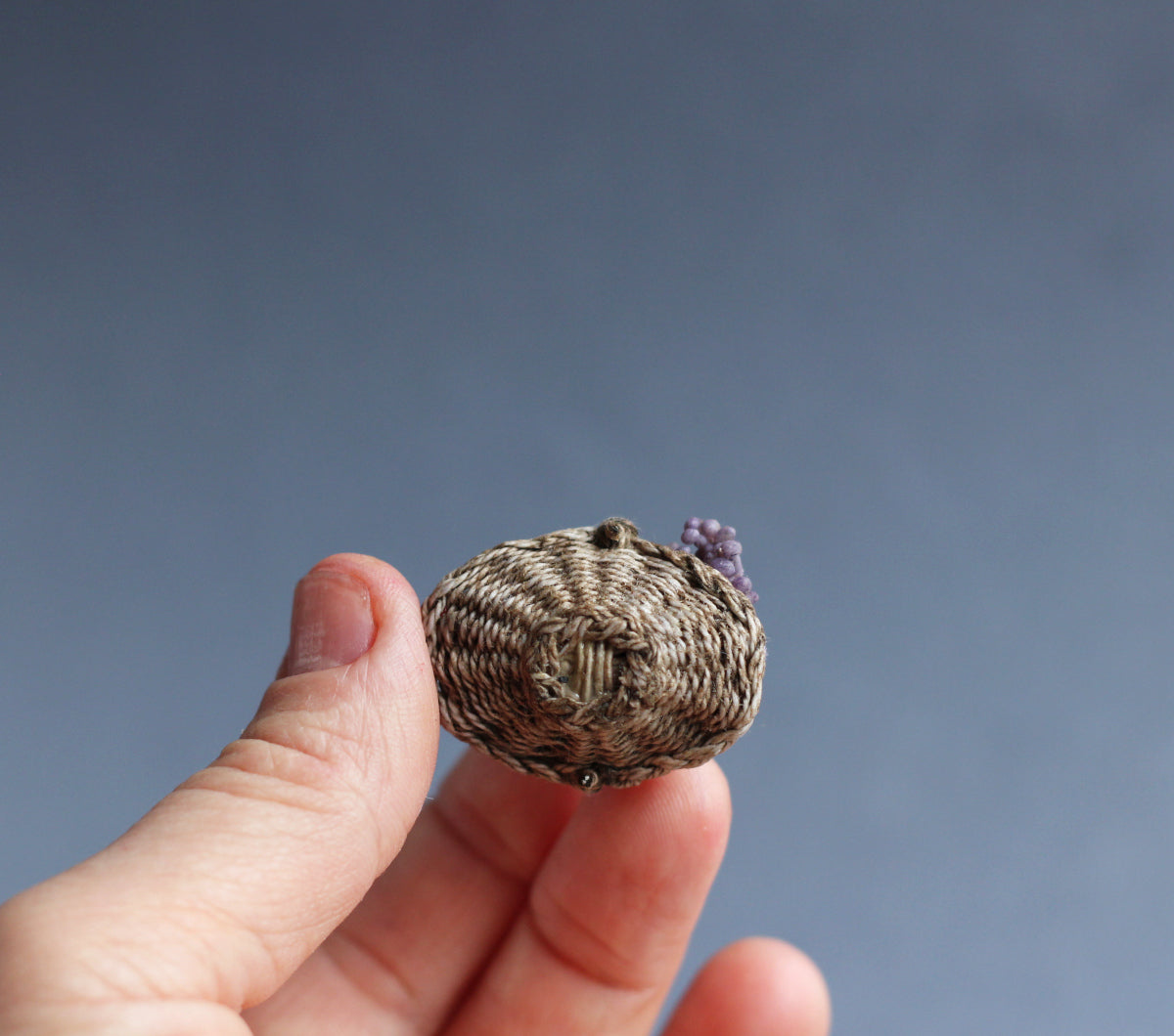 Wicker basket with fruit and grapes. Miniature 1:12