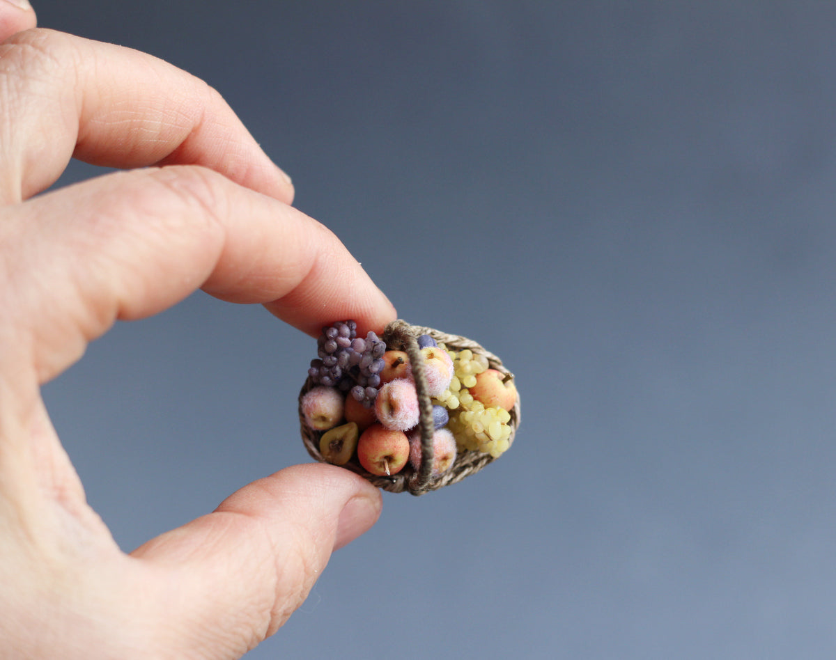 Wicker basket with fruit and grapes. Miniature 1:12