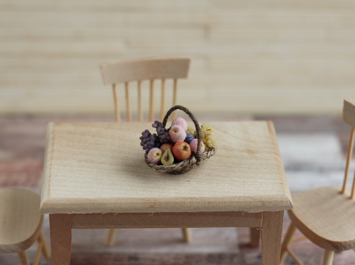 Wicker basket with fruit and grapes. Miniature 1:12